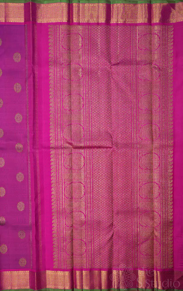Purple kanchipuram silk saree with rani pink border