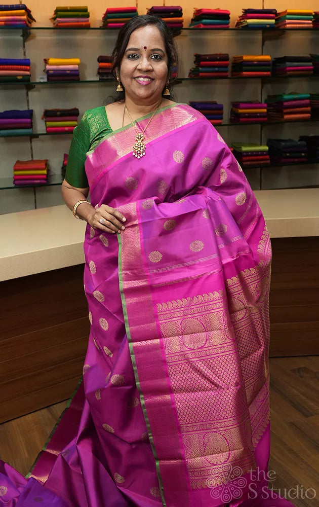 Purple kanchipuram silk saree with rani pink border