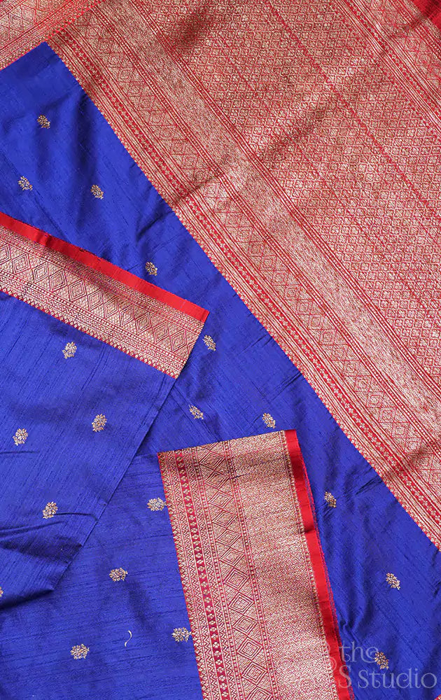 Blue raw silk saree with small zari buttas and contrast red border
