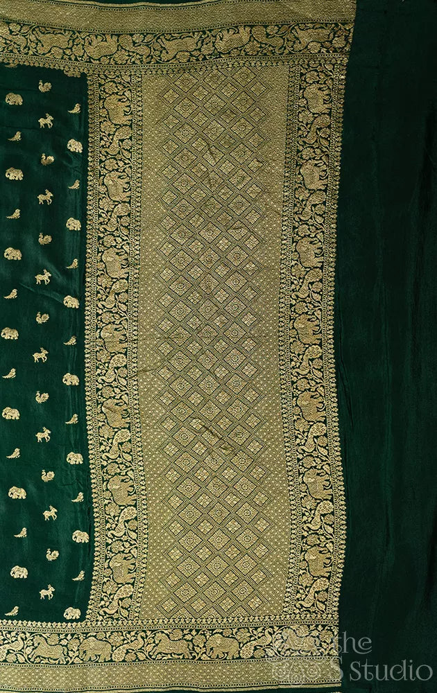 Green crepe banarasi silk saree with animal antique zari buttas