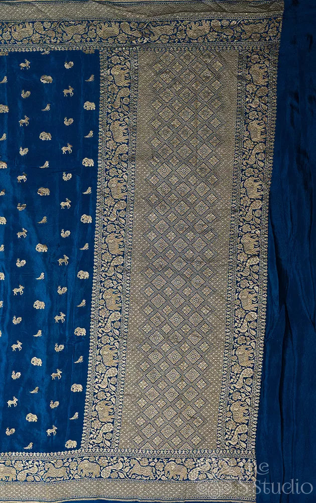 Peacock blue crepe banarasi silk saree with antique zari buttas
