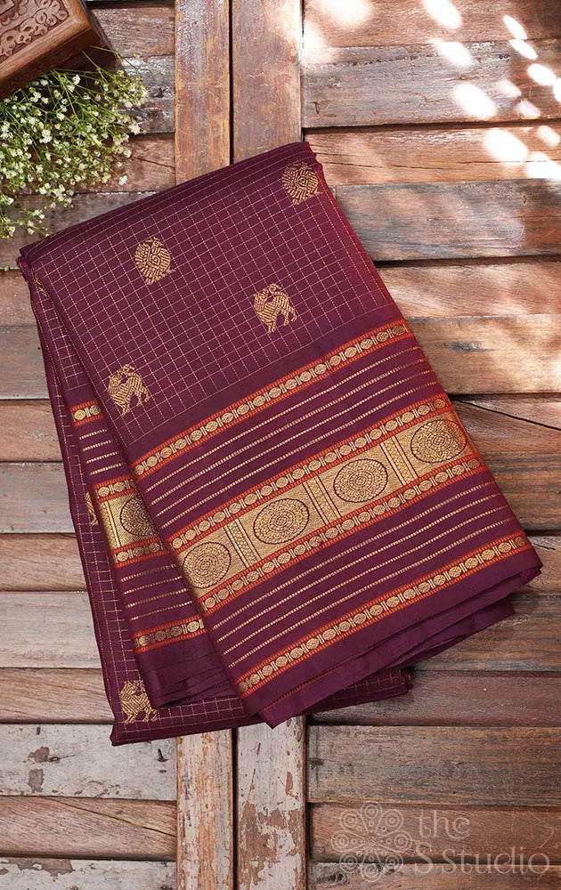 Brown zari checked kanchipuram silk saree with yazhi and peacock motifs
