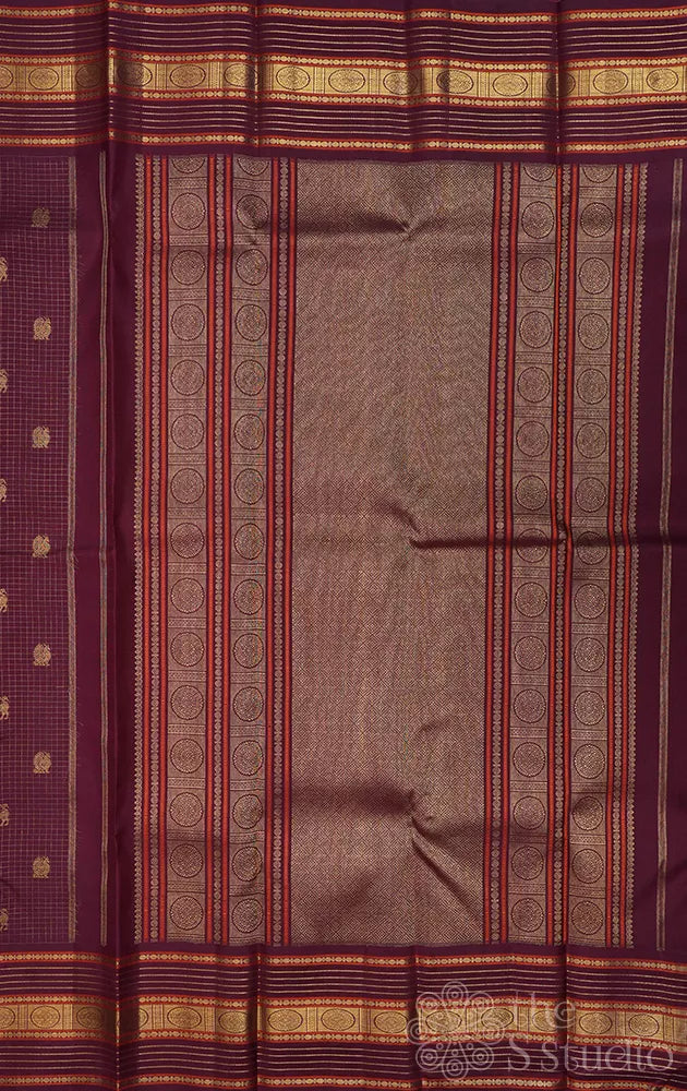 Brown zari checked kanchipuram silk saree with yazhi and peacock motifs