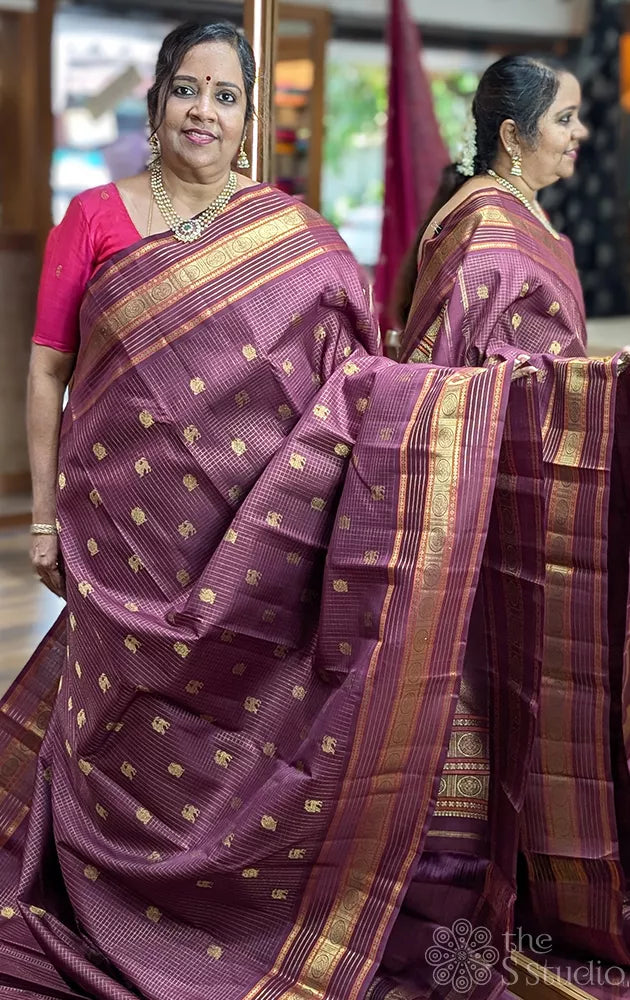 Brown zari checked kanchipuram silk saree with yazhi and peacock motifs