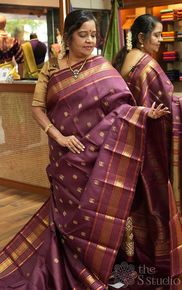 Brown zari checked kanchipuram silk saree with yazhi and peacock motifs