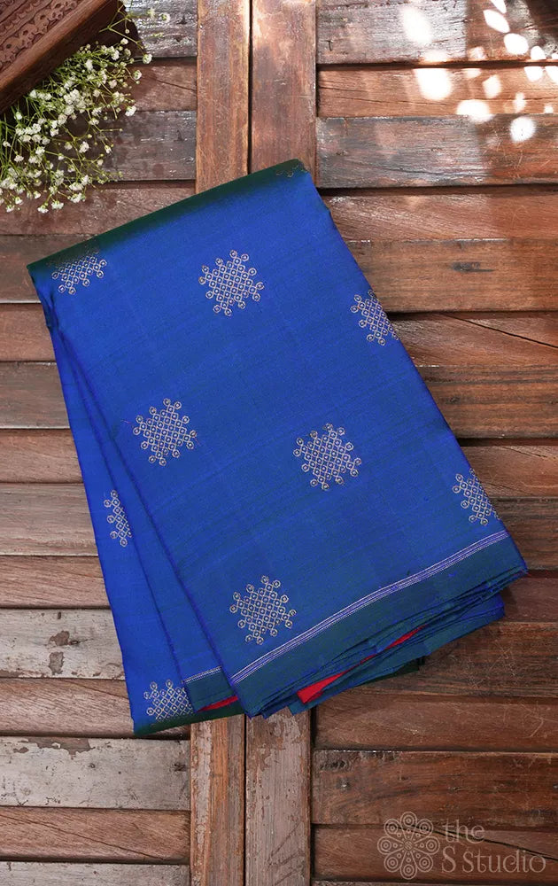 Peacock blue borderless kanchi silk saree with kolam buttas
