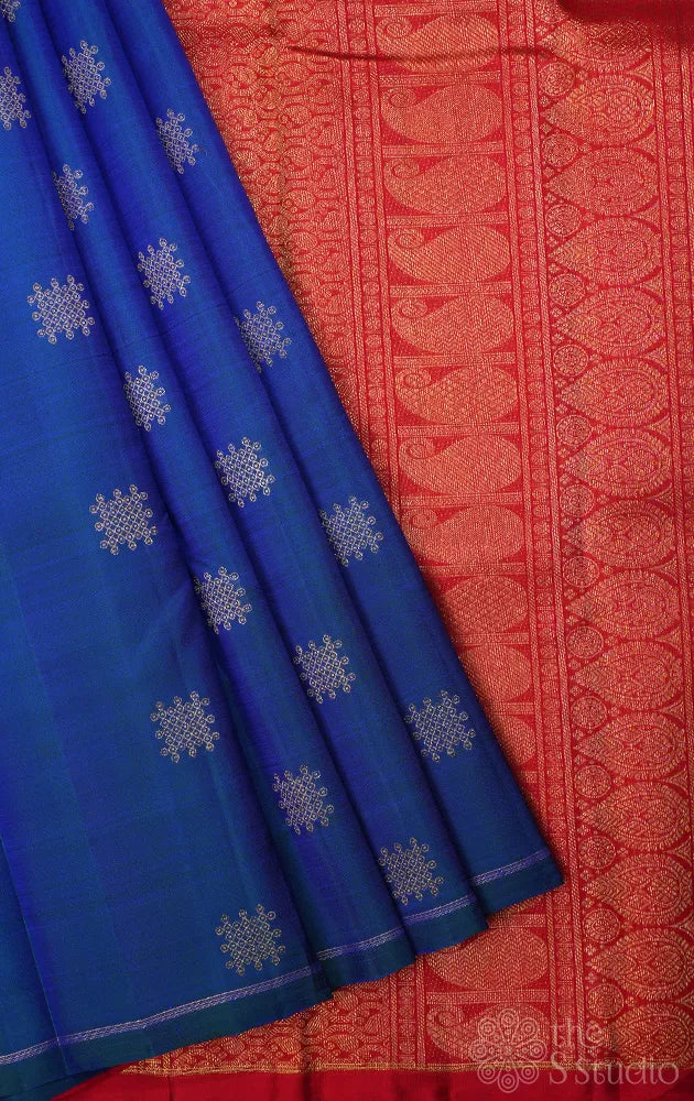 Peacock blue borderless kanchi silk saree with kolam buttas