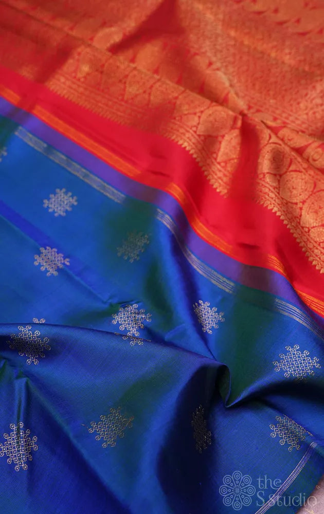 Peacock blue borderless kanchi silk saree with kolam buttas