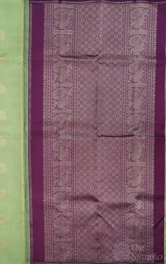 Elachi green kanchipuram silk saree with zari rich purple pallu