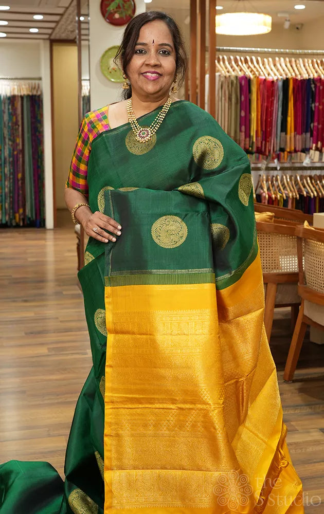 Bottle green kanjivaram silk saree with mustard pallu