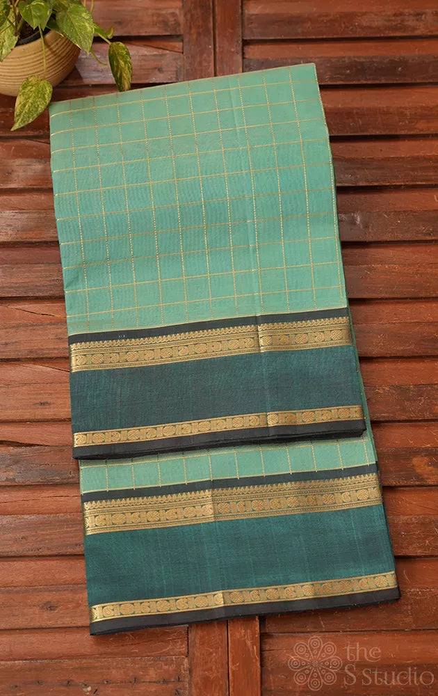 Pista green checked silk cotton saree with rettaipet border