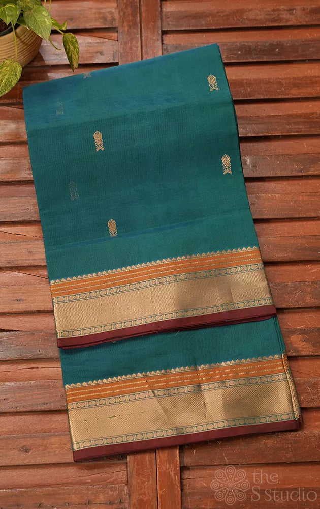Teal blue silk cotton saree with fishpet motif