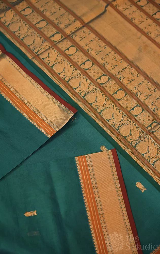 Teal blue silk cotton saree with fishpet motif