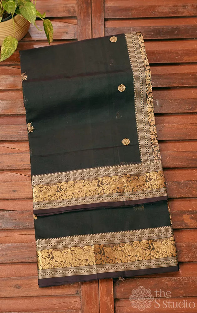 Dark green handloom silk cotton saree with small zari border
