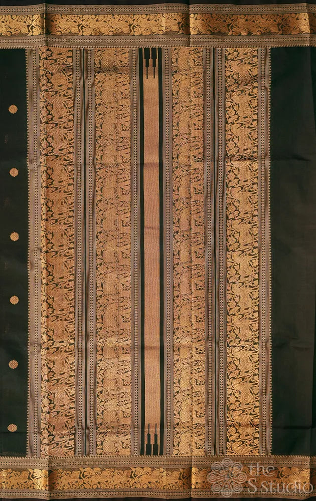 Dark green handloom silk cotton saree with small zari border