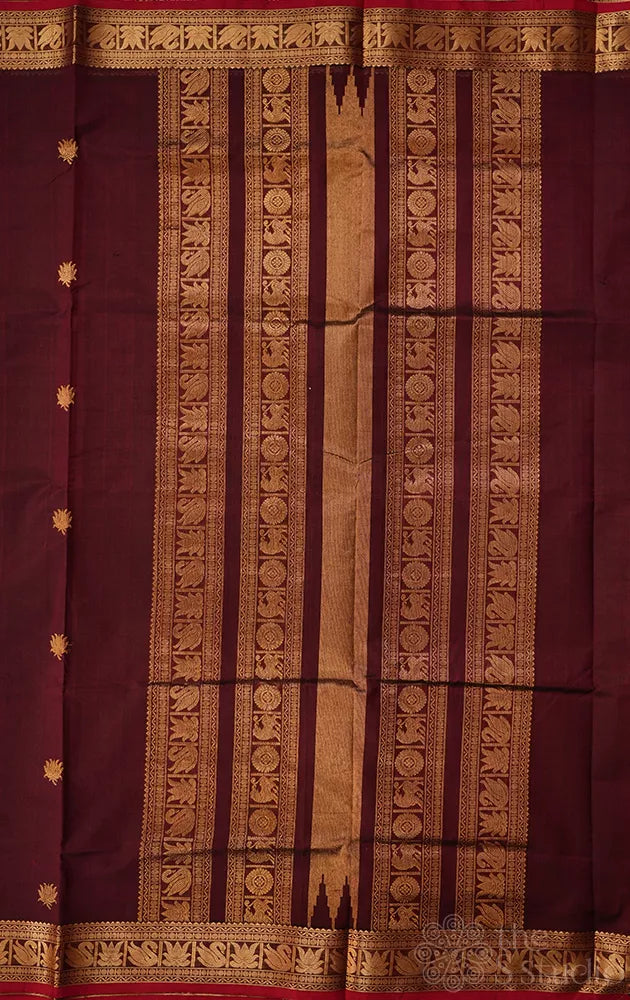 Maroon handwoven silk cotton saree with pichwai motifs