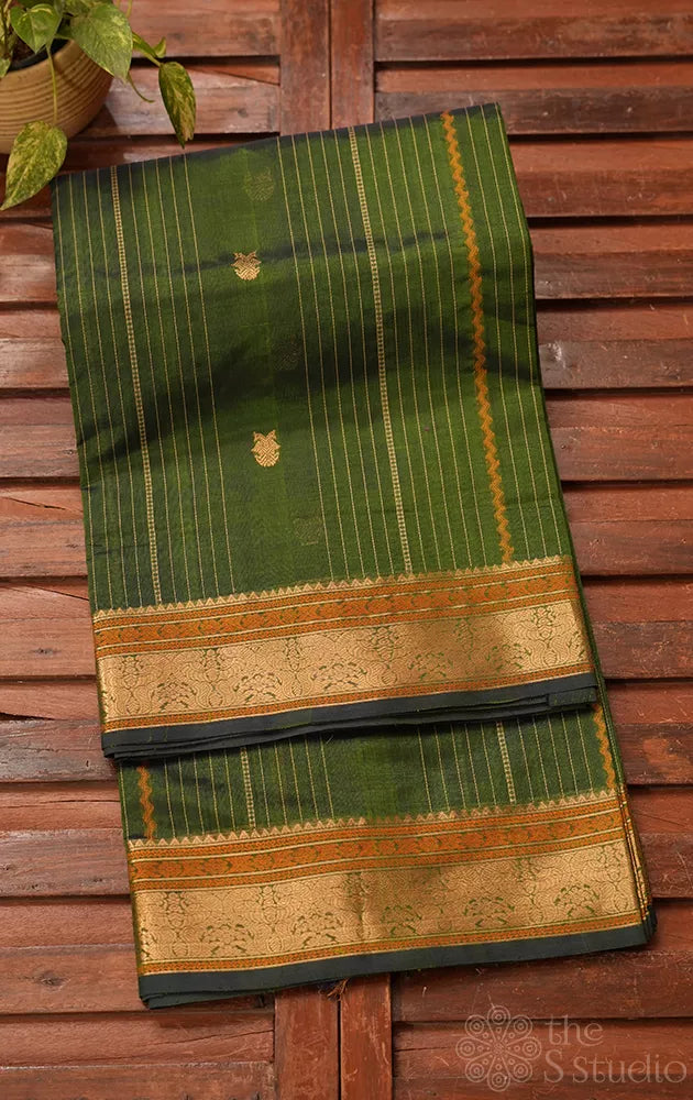 Green silk cotton saree with vertical lines and zari border