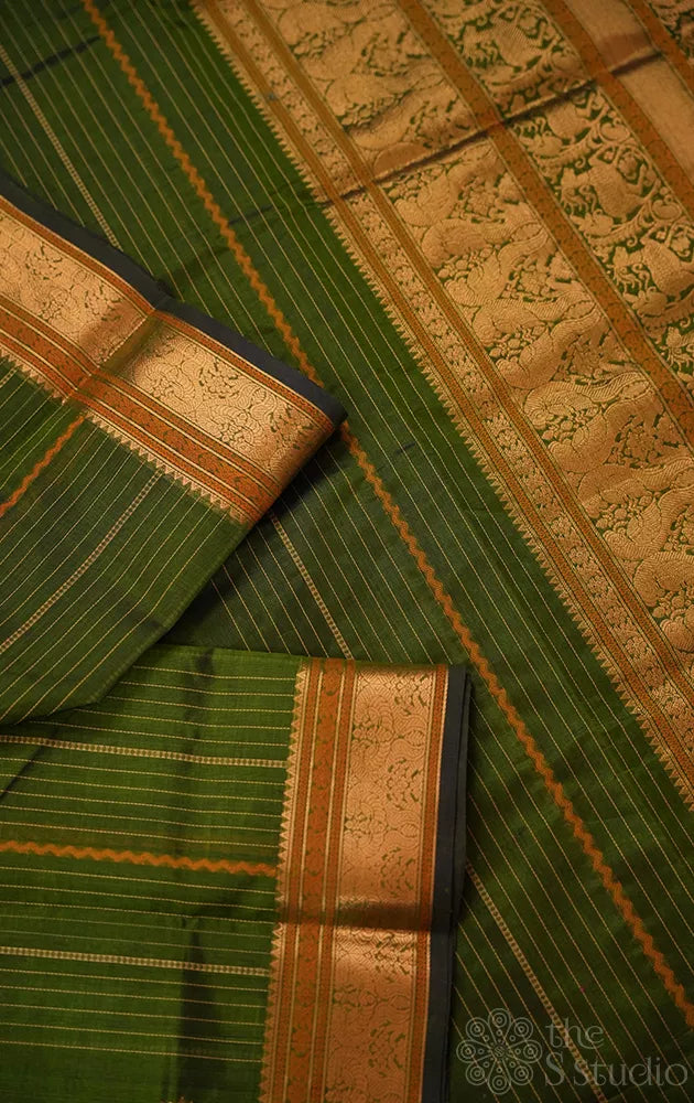 Green silk cotton saree with vertical lines and zari border