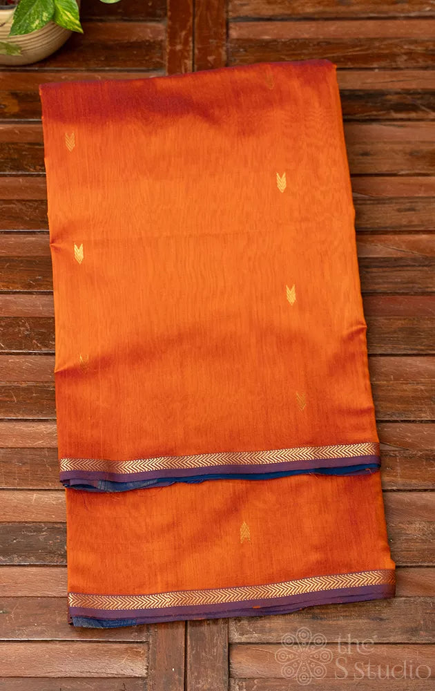 Rust orange maheshwari silk cotton saree with green pallu