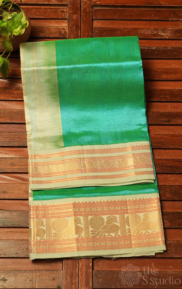 Sea green plain silk cotton saree with korvai border