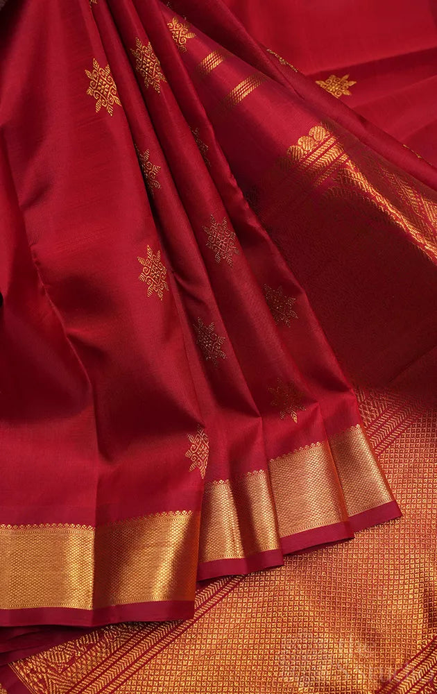Maroon kanchipuram silk saree with all over buttas and getti border