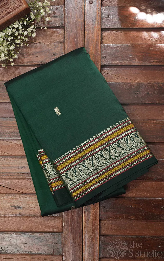 Bottle green kanchipuram silk saree with thread work border