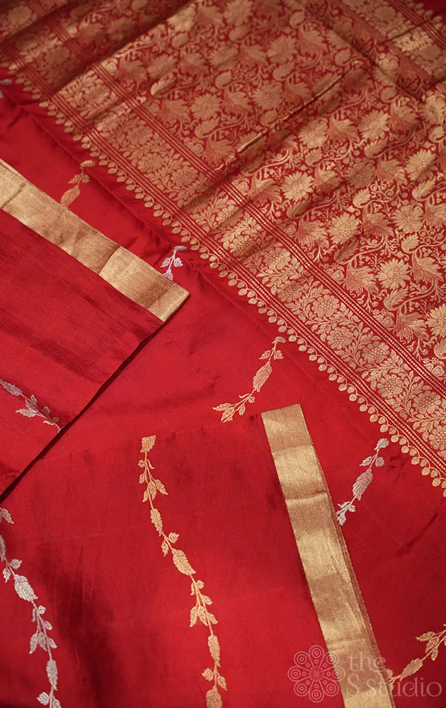 Red lightweight katan banarasi silk saree with floral  zari creepers design