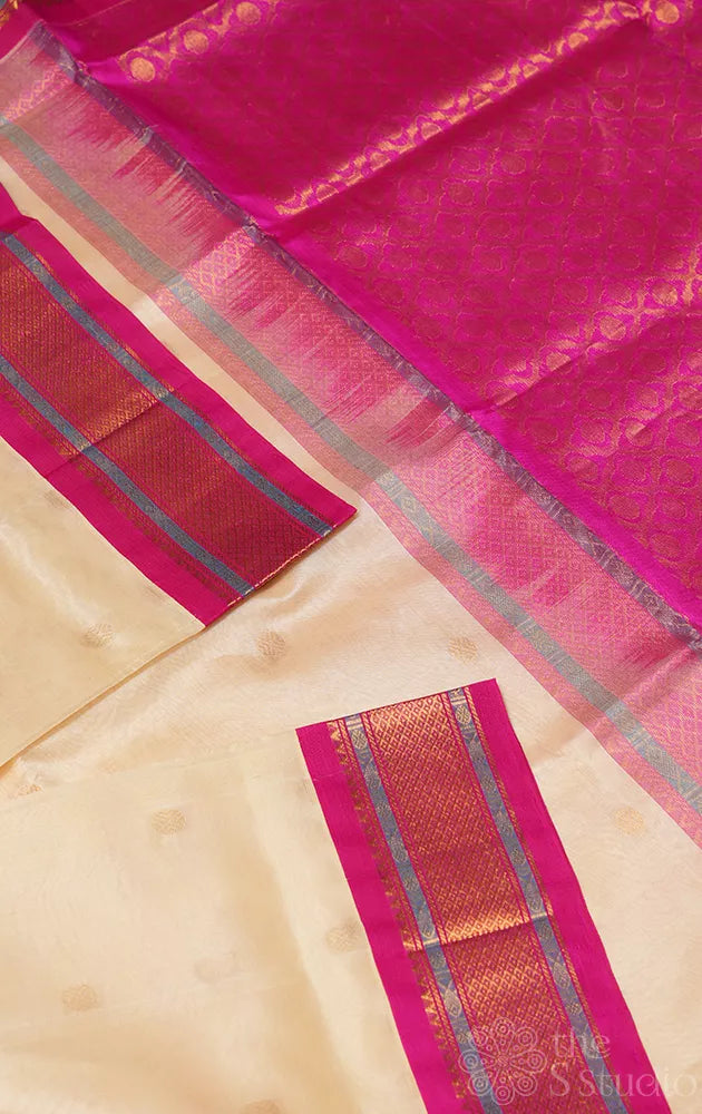 Off white silk cotton saree with contrast korvai pink border