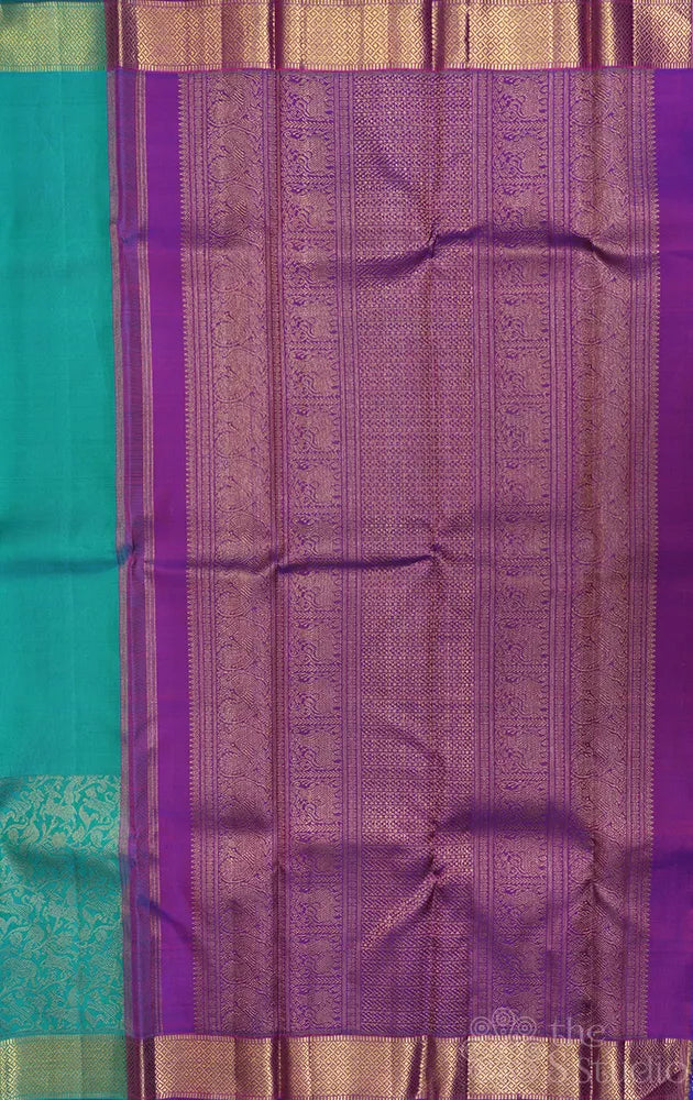 Bluish green kanchi silk saree with vanasingharam design and getti border
