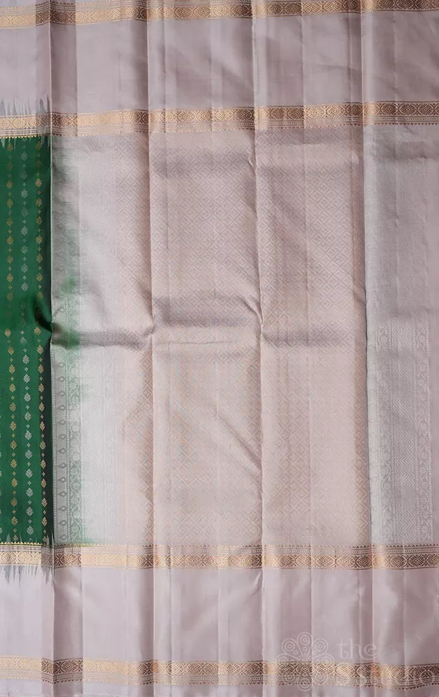 Green light weight silk saree with small zari buttas