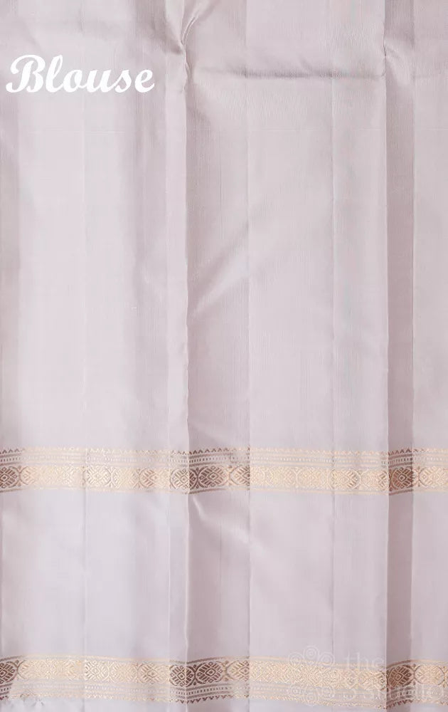 Green light weight silk saree with small zari buttas