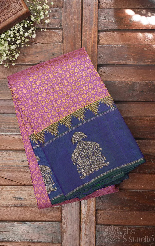 Mauve colour thread woven kanchi silk saree with peacock blue butta woven border