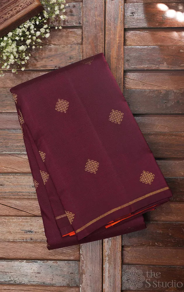Brown kolam butta kanjivaram saree with orange pallu and blouse