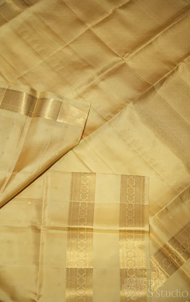 Cream colour soft silk saree with rettaipet zari border
