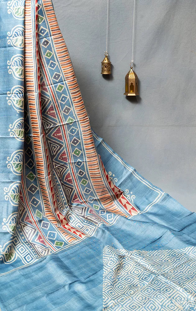 Powder blue tussar silk saree with geometrical batik prints