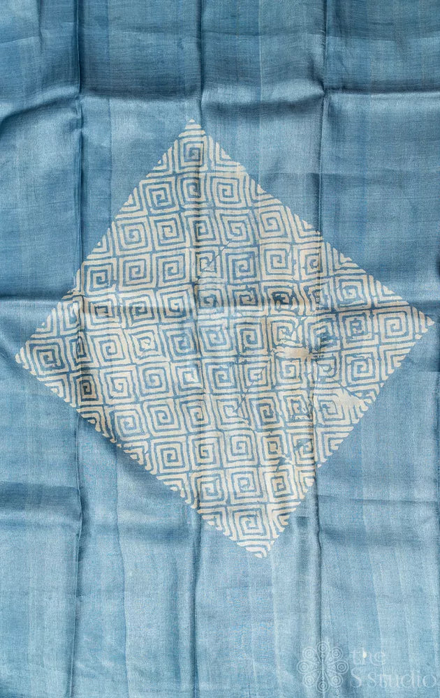 Powder blue tussar silk saree with geometrical batik prints