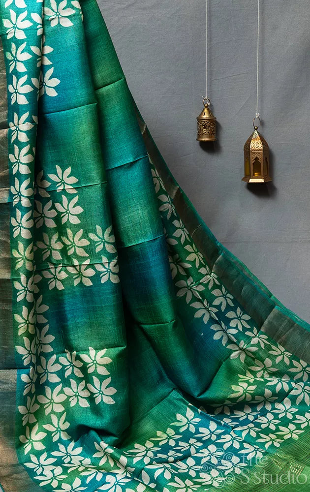 Sea green tussar silk saree with white floral prints