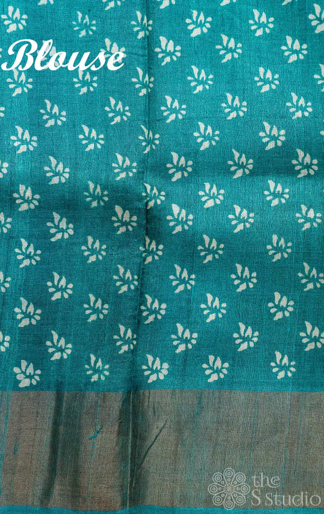 Sea green tussar silk saree with white floral prints
