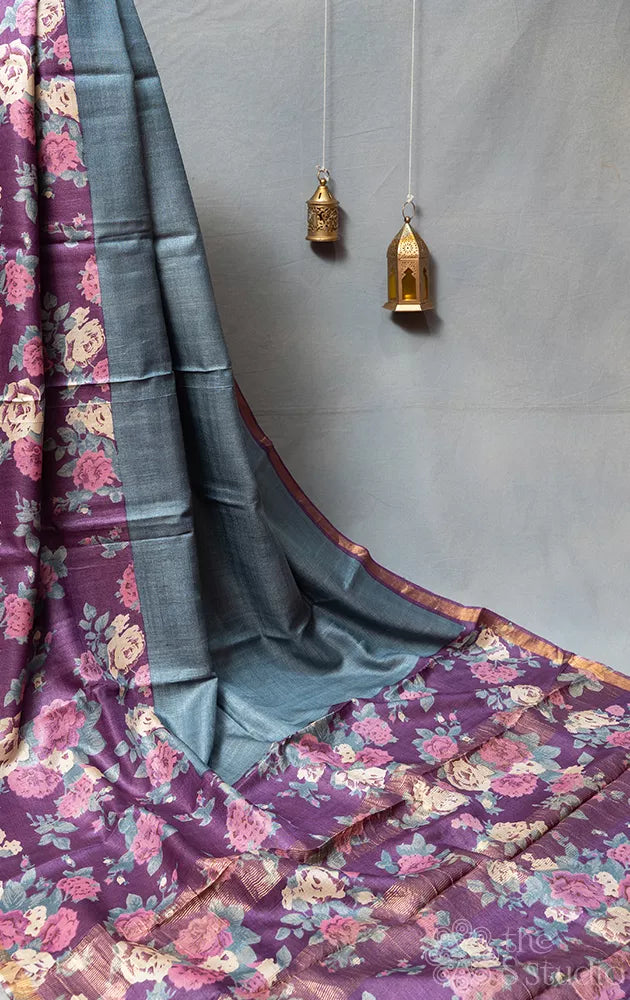 Grey tussar silk saree with purple floral prints on the border