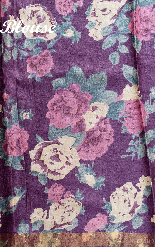 Grey tussar silk saree with purple floral prints on the border