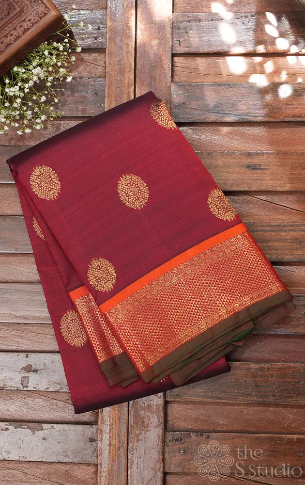 Maroon kanjivaram silk saree with buattas
