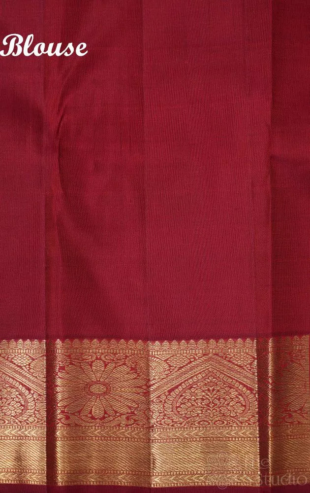 Maroon kanjivaram silk saree with all over floral meenakari motifs and grand border