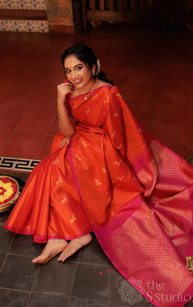 Orange deer butta kanjivaram silk saree with rani pink pallu