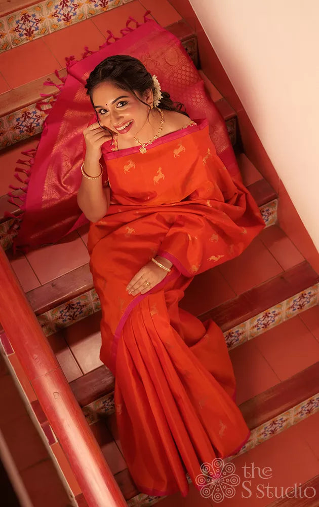 Orange deer butta kanjivaram silk saree with rani pink pallu