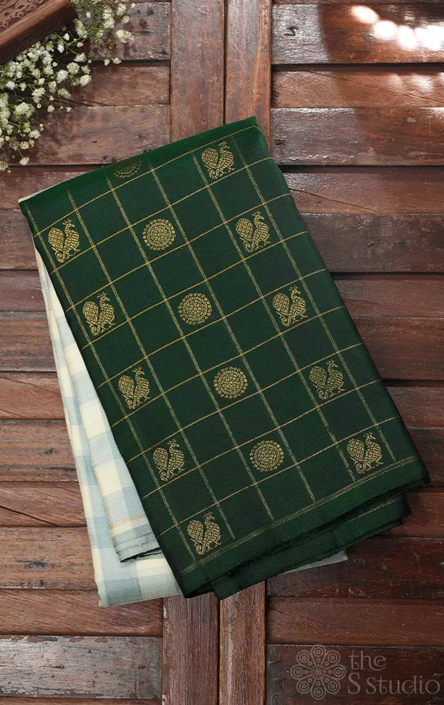 White and pastel green checked kanchi silk saree with bottle green long border
