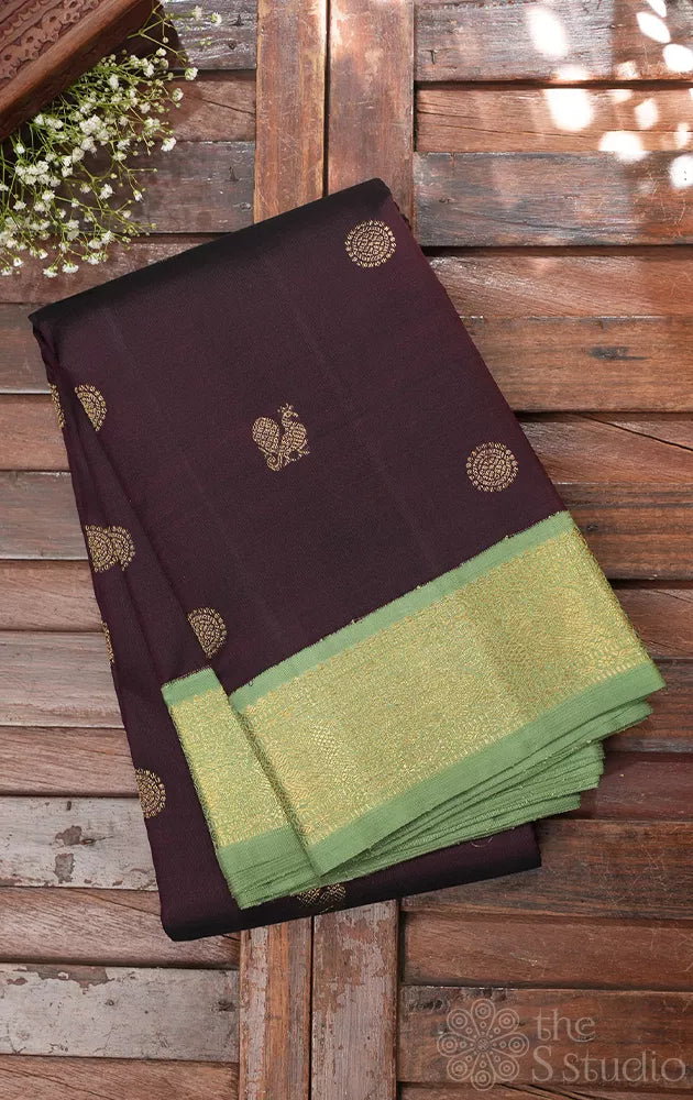 Dark brown korvai kanchipuram silk saree with small elachi green border