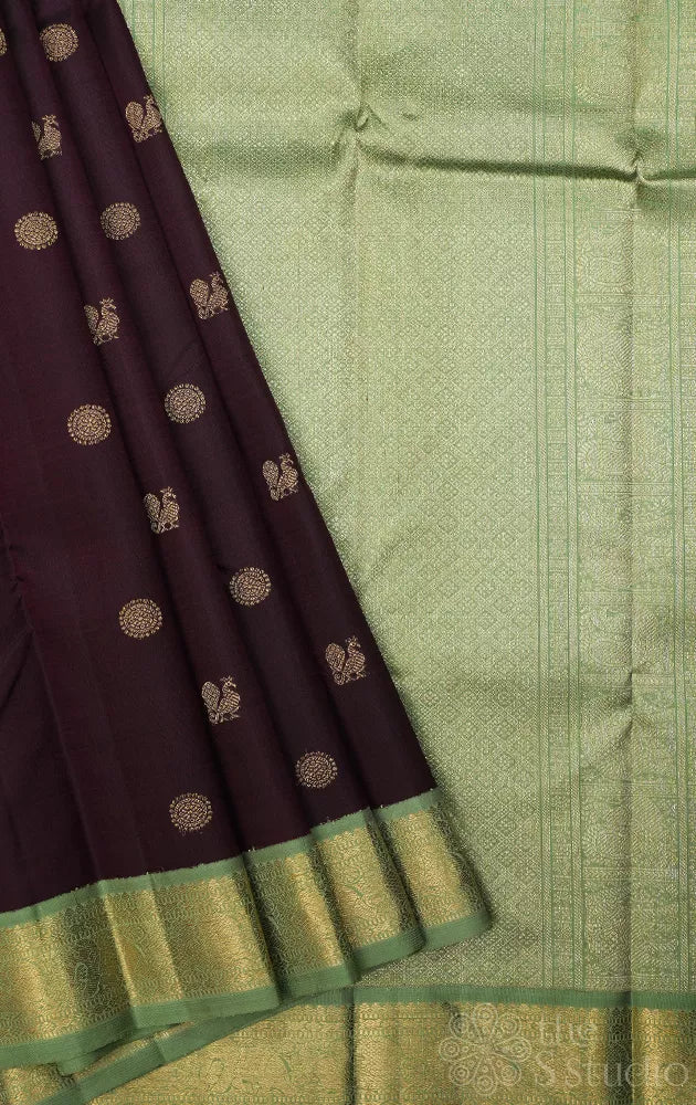 Dark brown korvai kanchipuram silk saree with small elachi green border