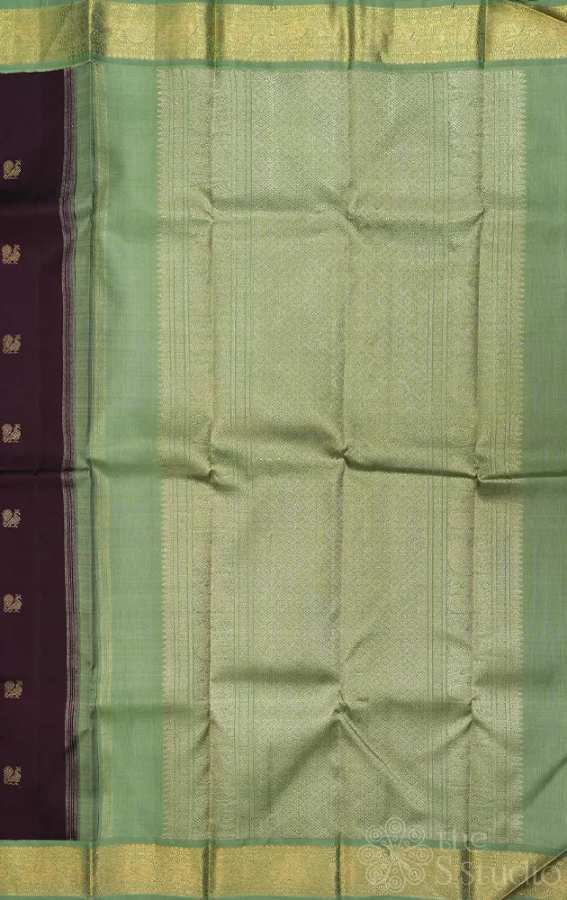 Dark brown korvai kanchipuram silk saree with small elachi green border