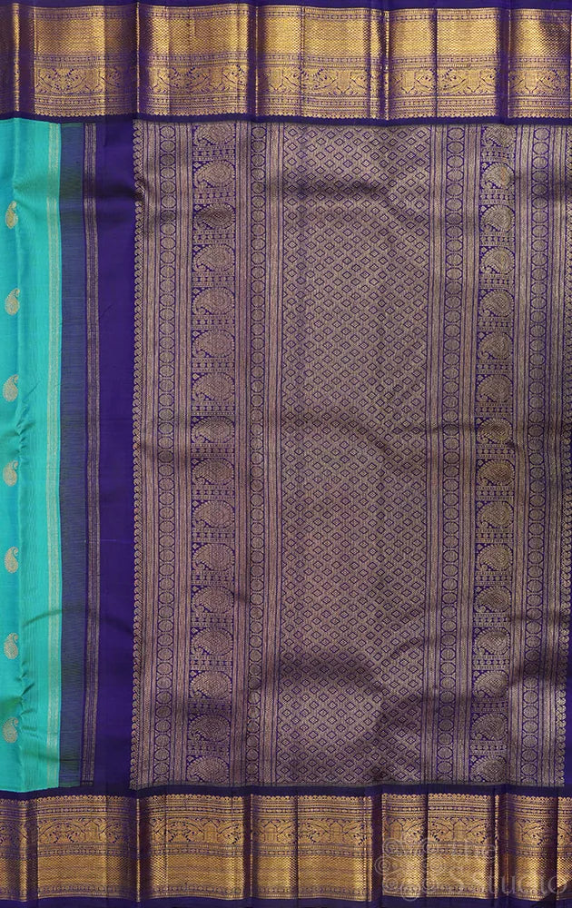 Sea green kanchi silk saree with korvai navy blue border