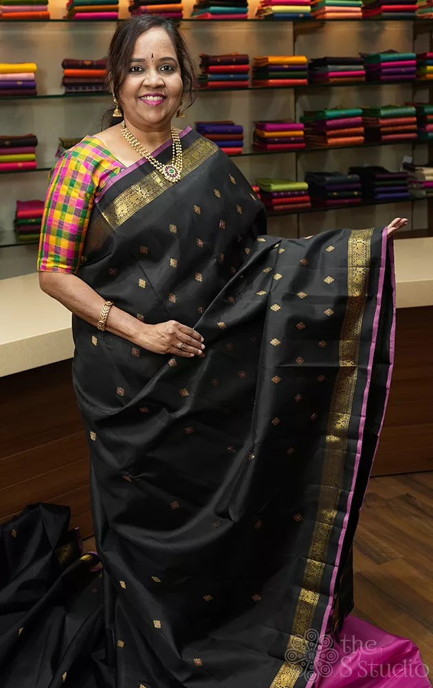 Black kanjivaram silk saree with meenakari butta with dark rani pink selvedge
